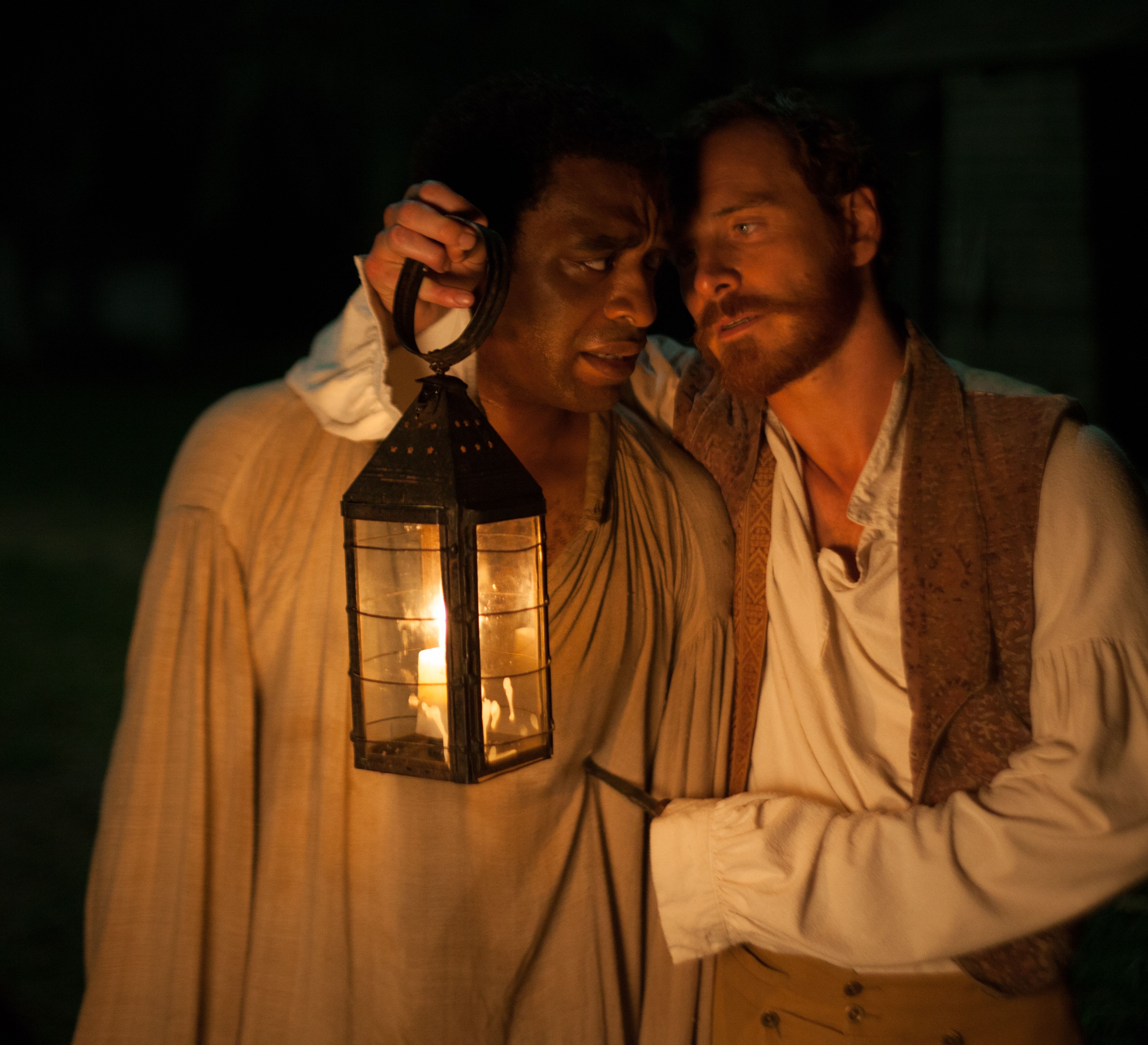 Chiwetel Ejiofor and Michael Fassbender in the dark, with a 