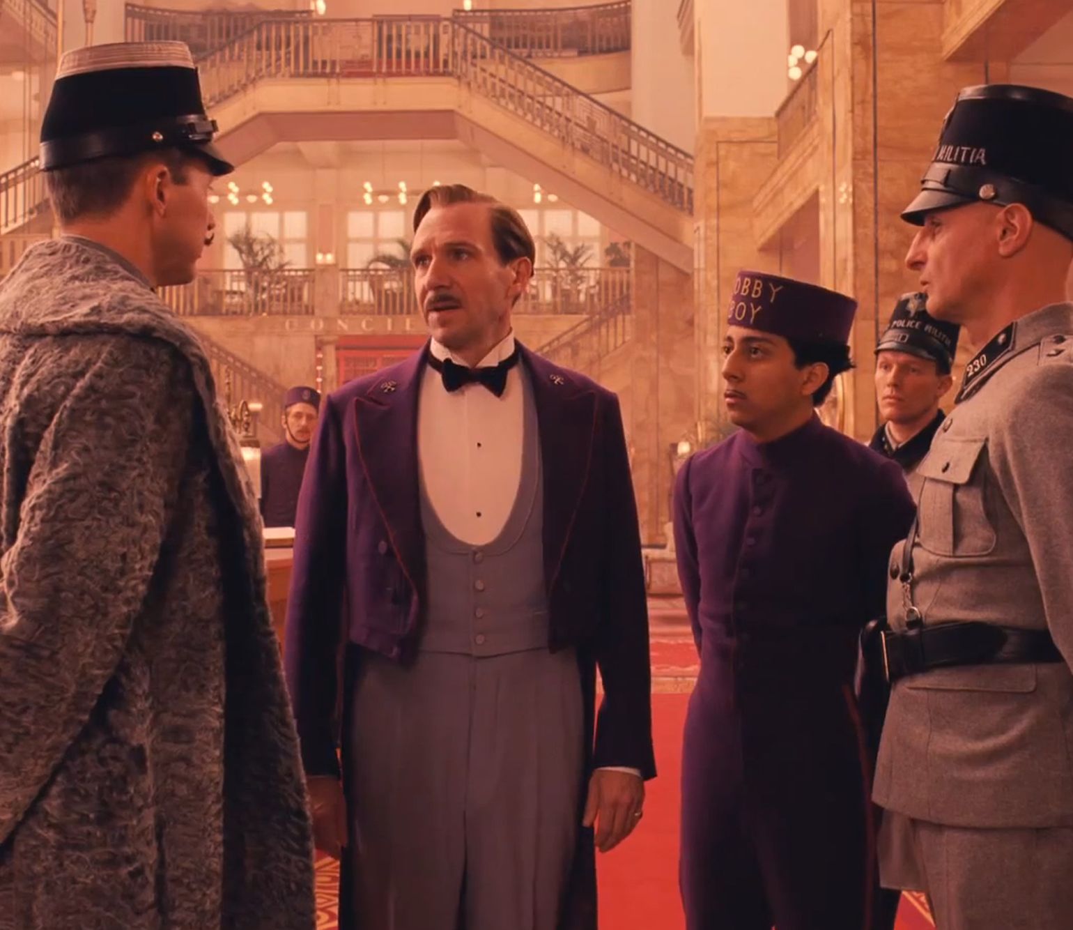 Ralph Fiennes in purple in The Grand Budapest Hotel