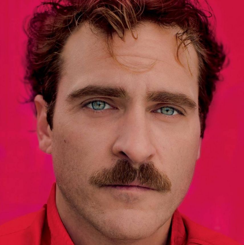Joaquin Phoenix in pinkish red