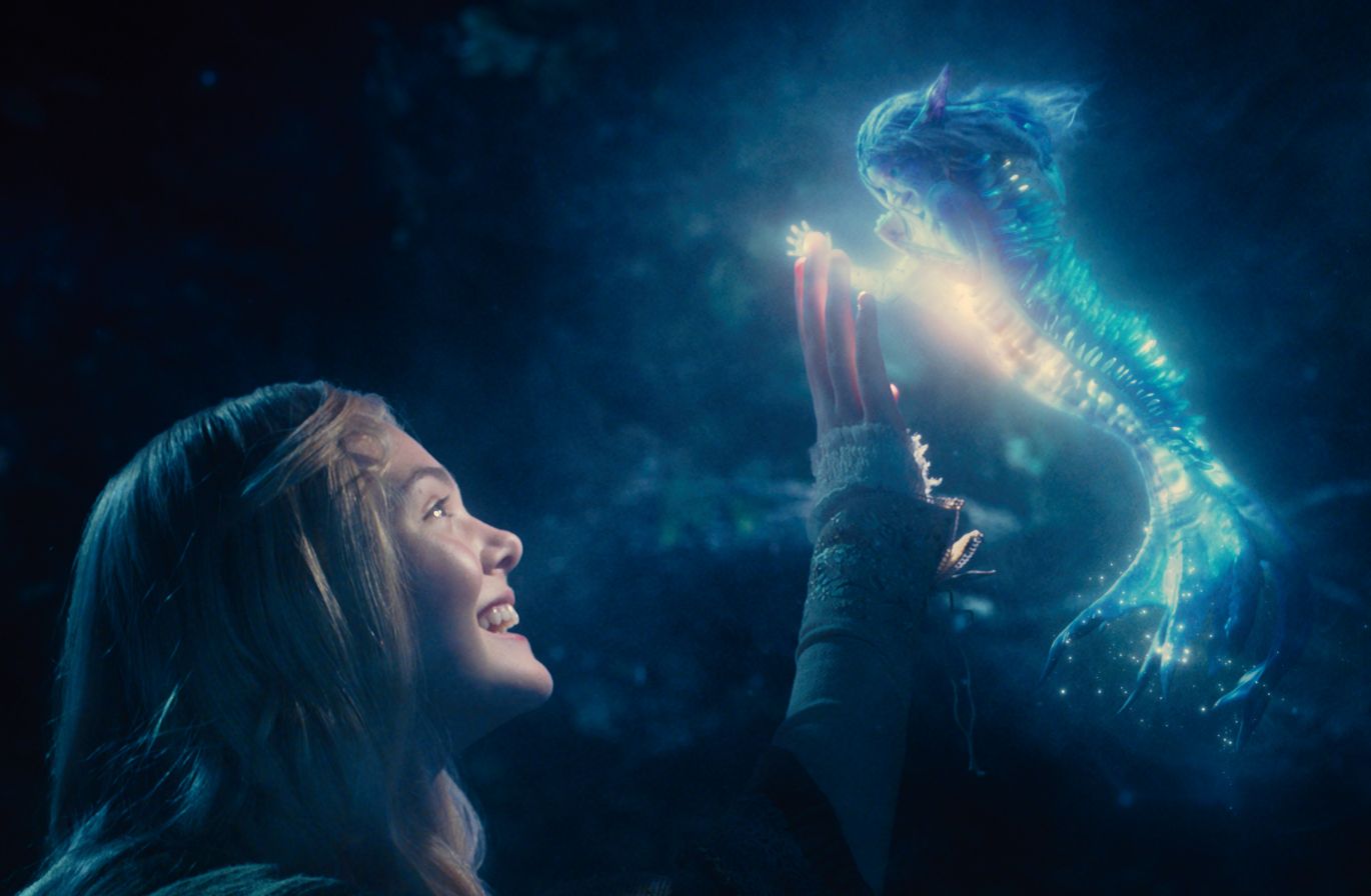 Elle Fanning as Princess Aurora touching fantastical creatur