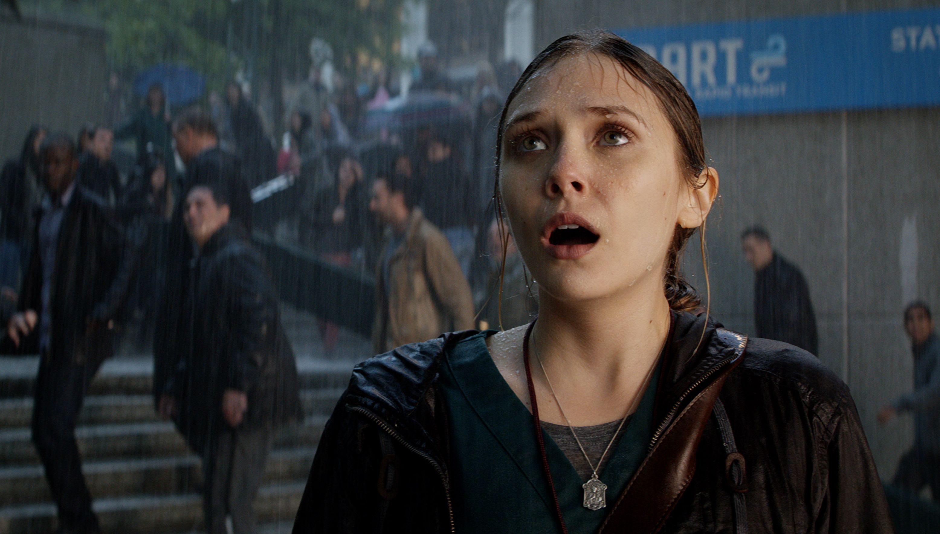 Elizabeth Olsen sees Godzilla in the rain