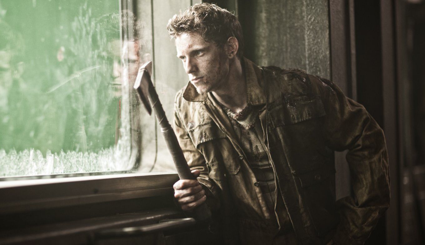 Jamie Bell with pickaxe in Snowpiercer