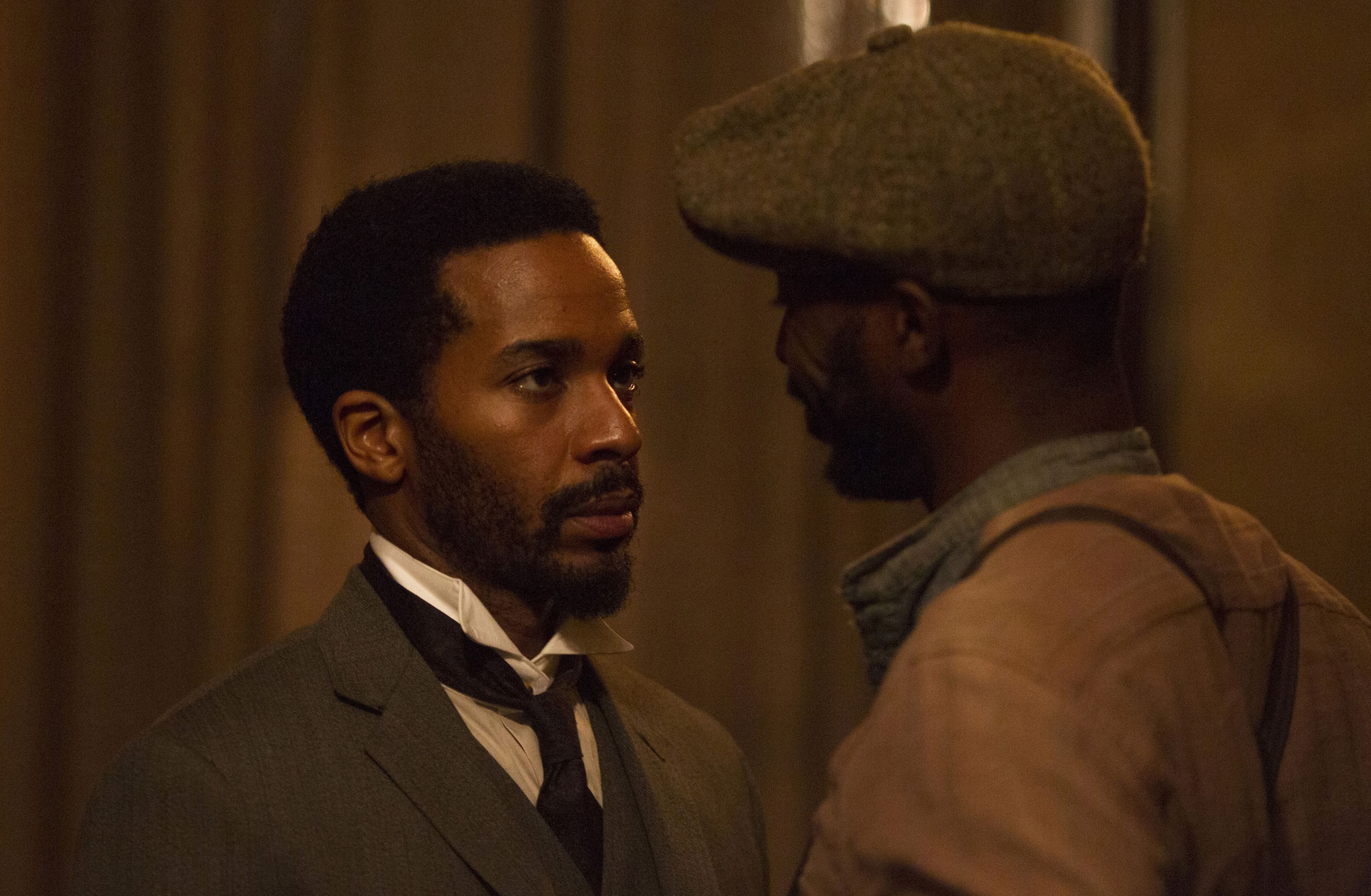 André Holland as Dr. Algernon Edwards having a conversation