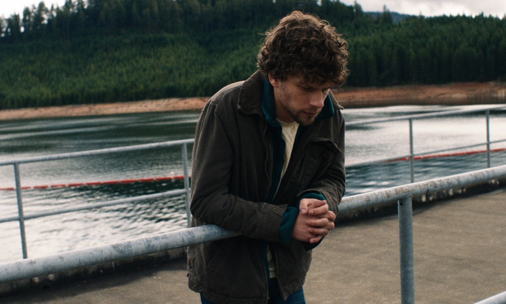 Jesse Eisenberg on a bridge