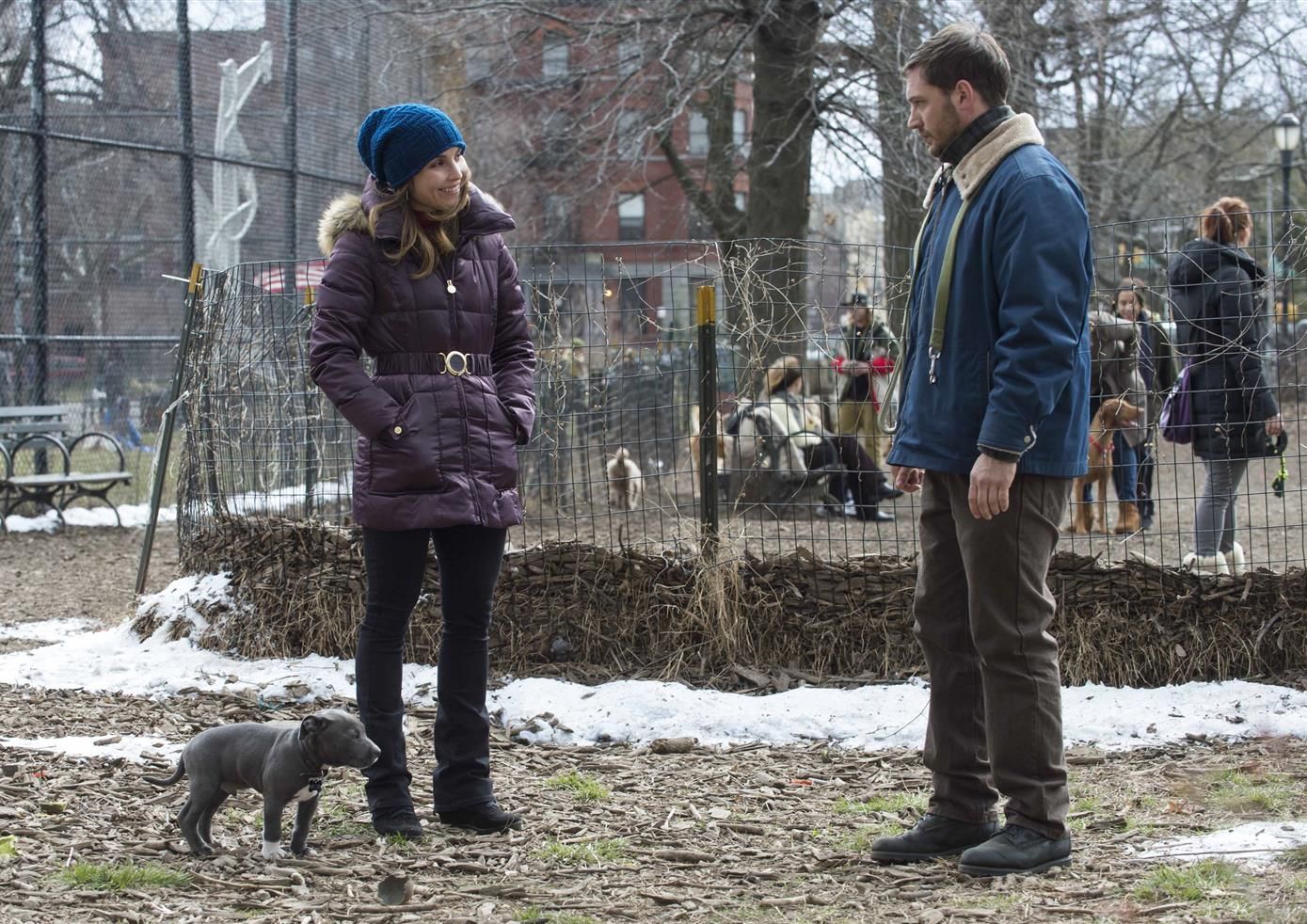 Noomi Rapace and Tom Hardy walk the dog