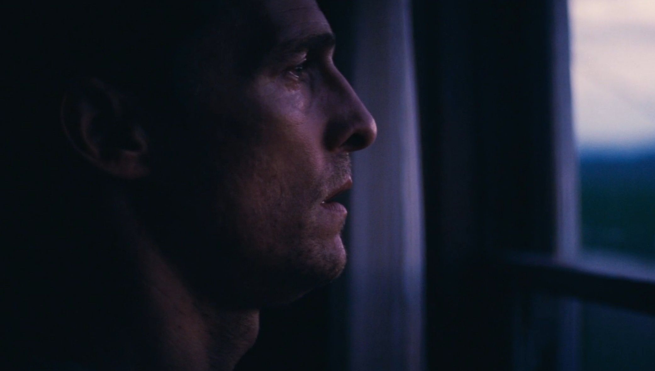 Matthew McConaughey looking out the dark window, Interstella