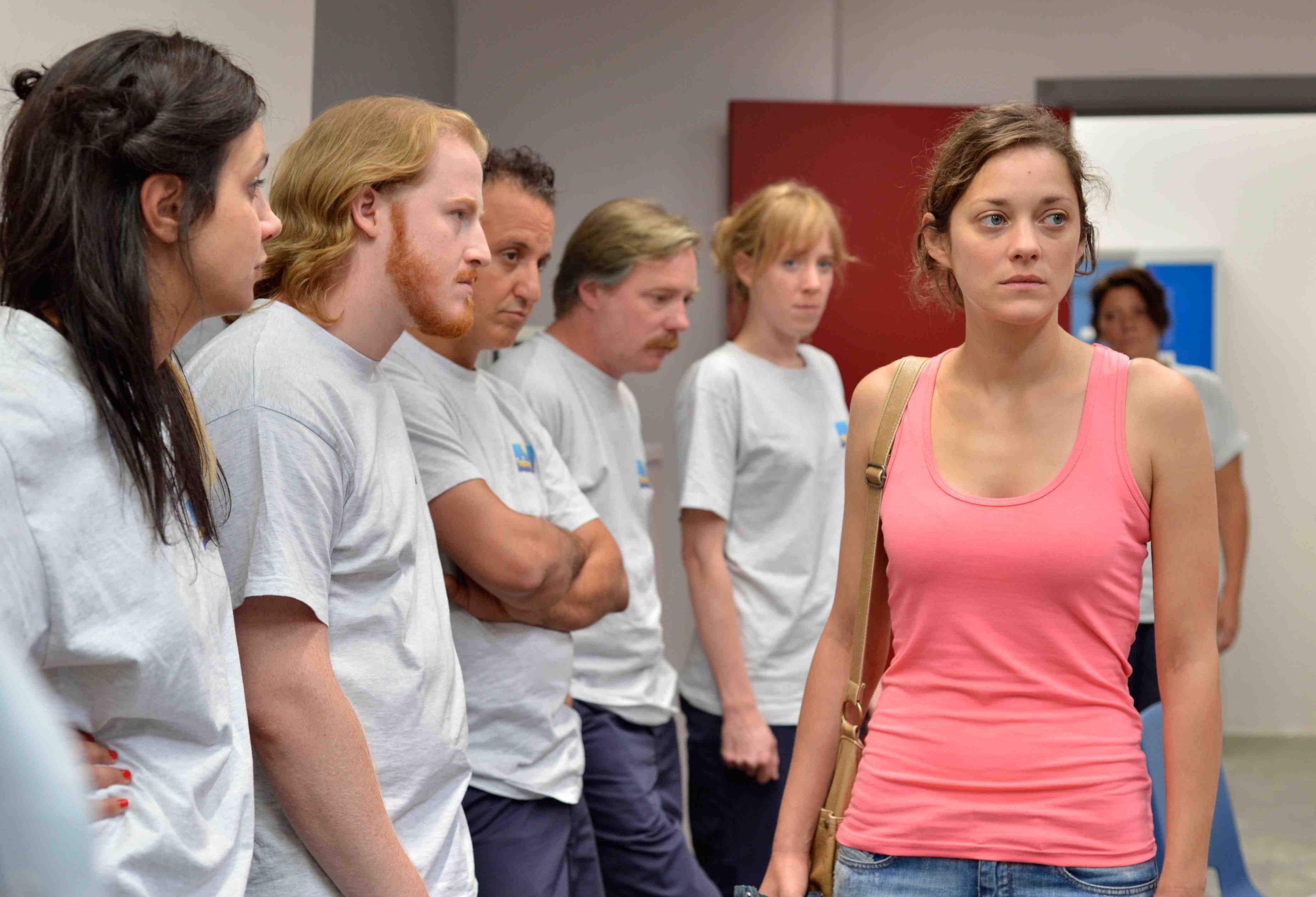 Marion Cotillard as Sandra being judged by her co-workers