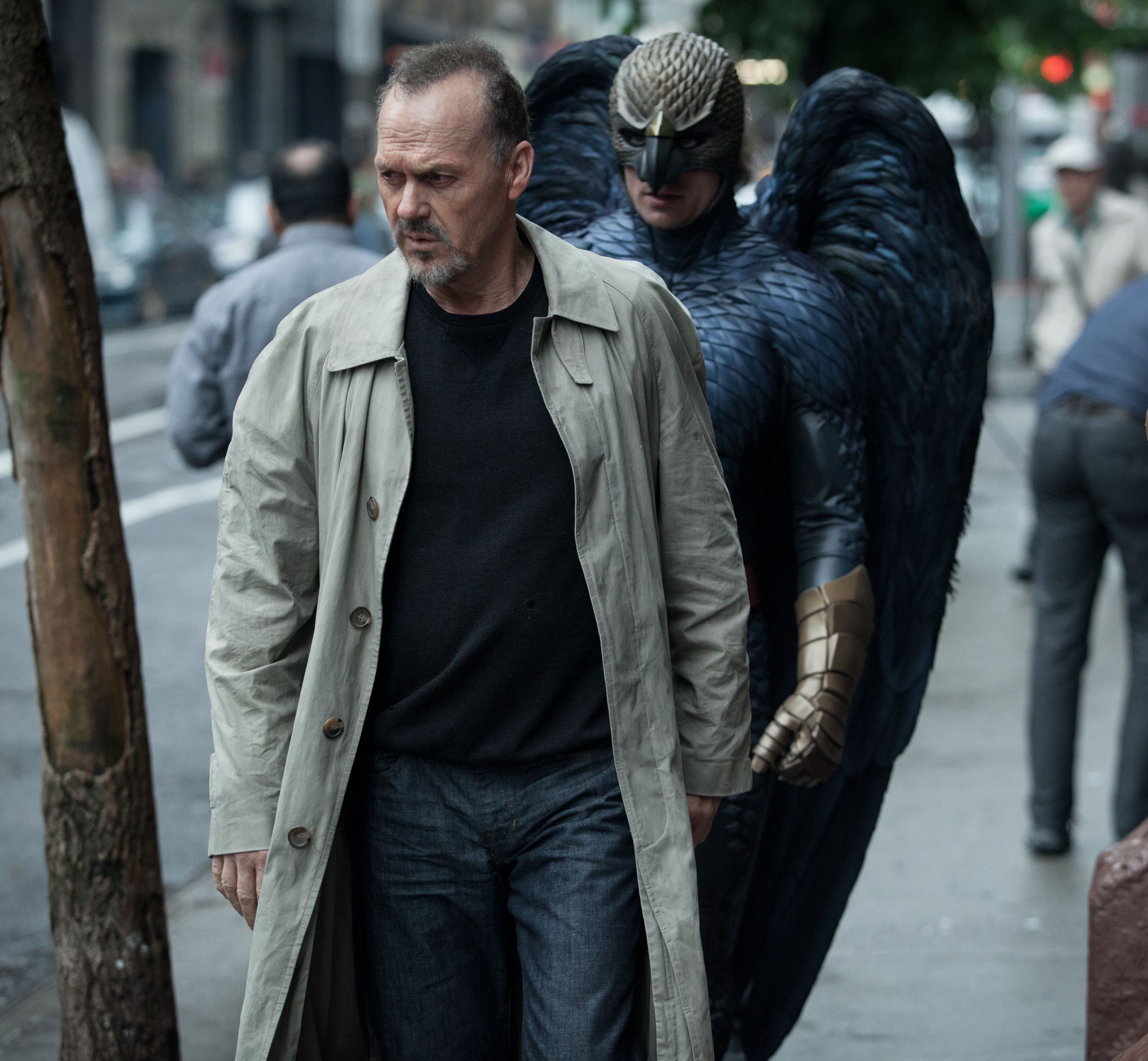 A man in birdsuit follow Michael Keaton around in Birdman