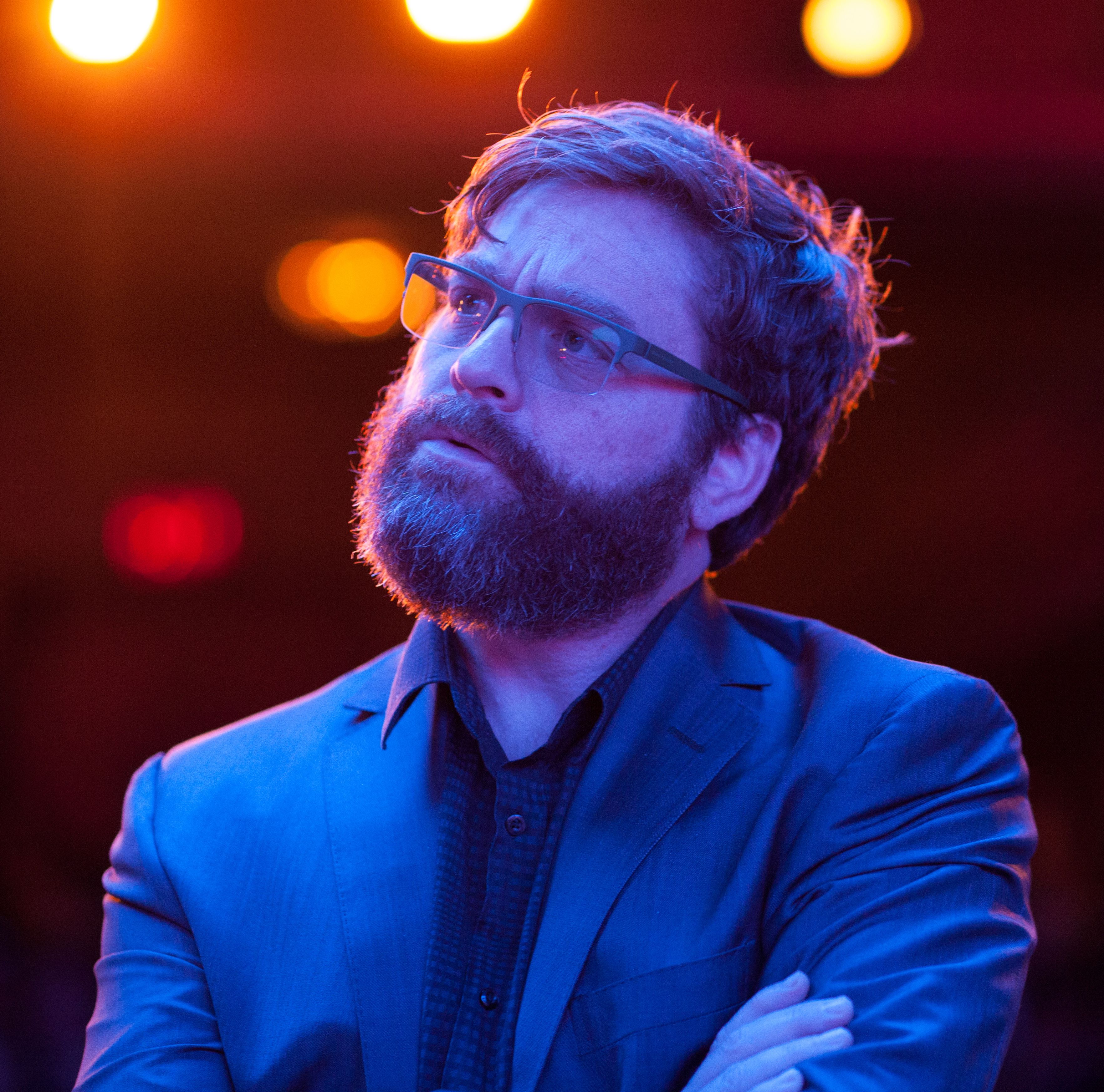 Zach Galifianakis as Jake looking bright on stage