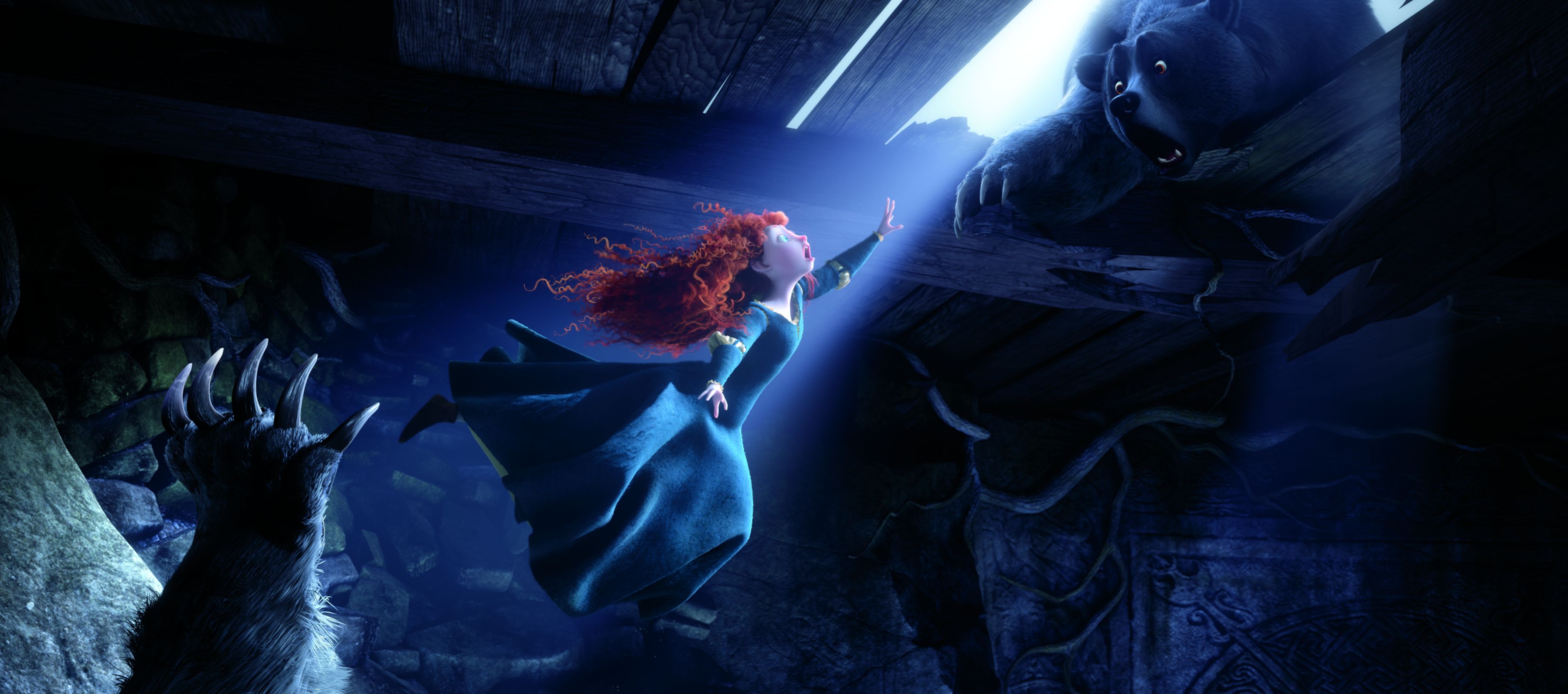 Merida falls as the bear tries to grab her hand in Brave