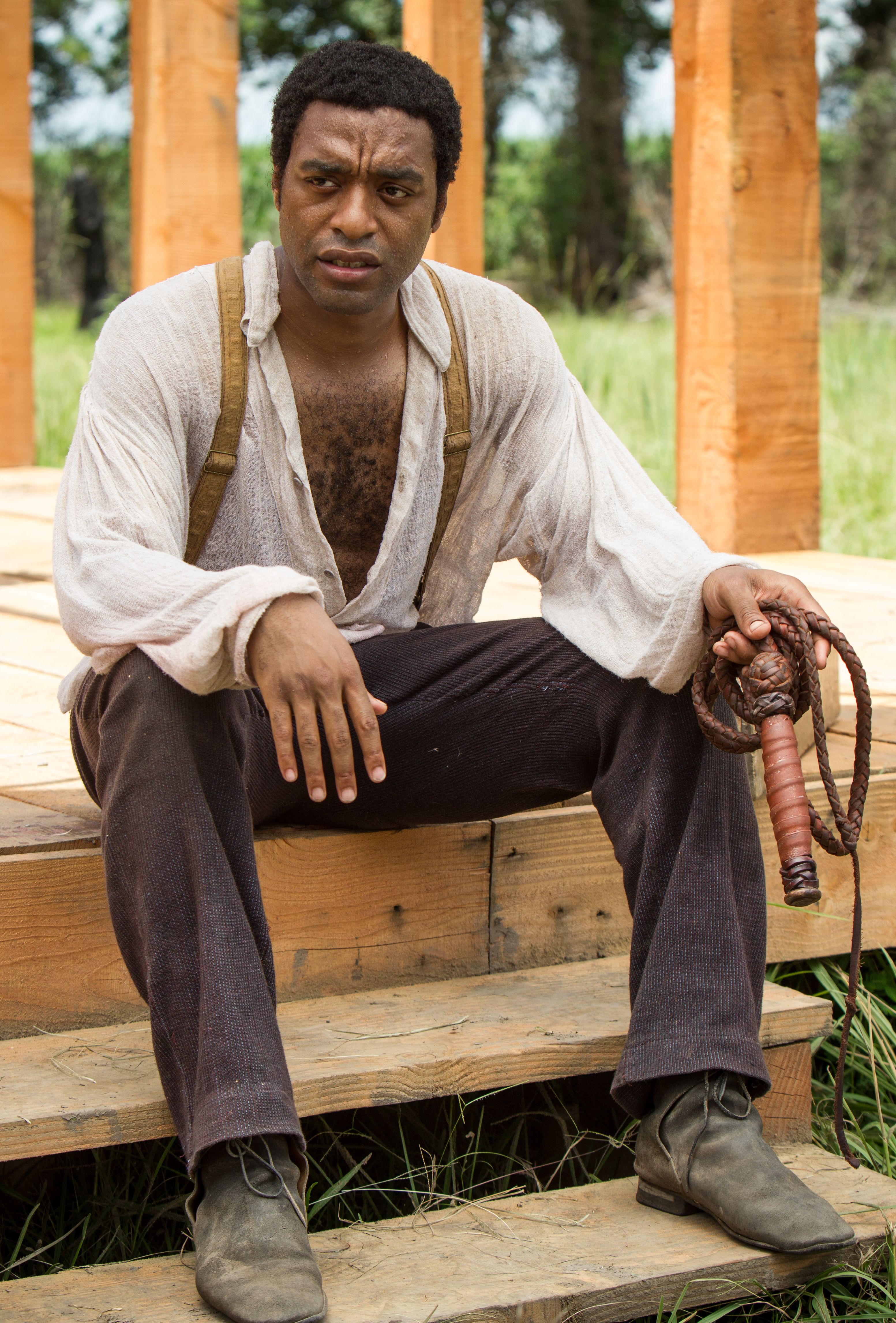 Solomon Northup with a whip in his hand