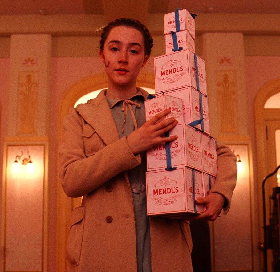 Saoirse Ronan as Agatha with a bunch of Mendl&#039;s boxes - The 
