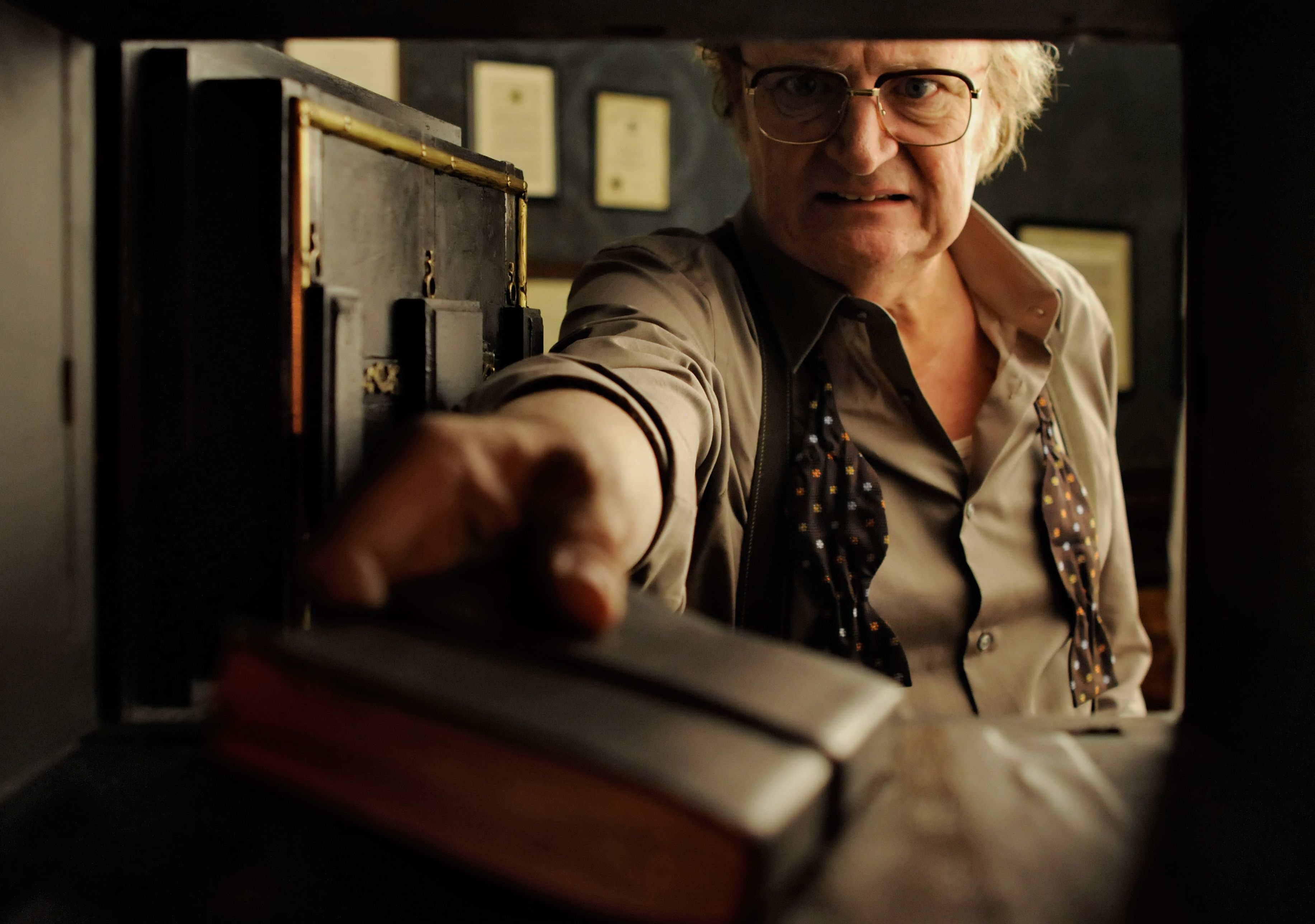 Jim Broadbent and his book in Cloud Atlas