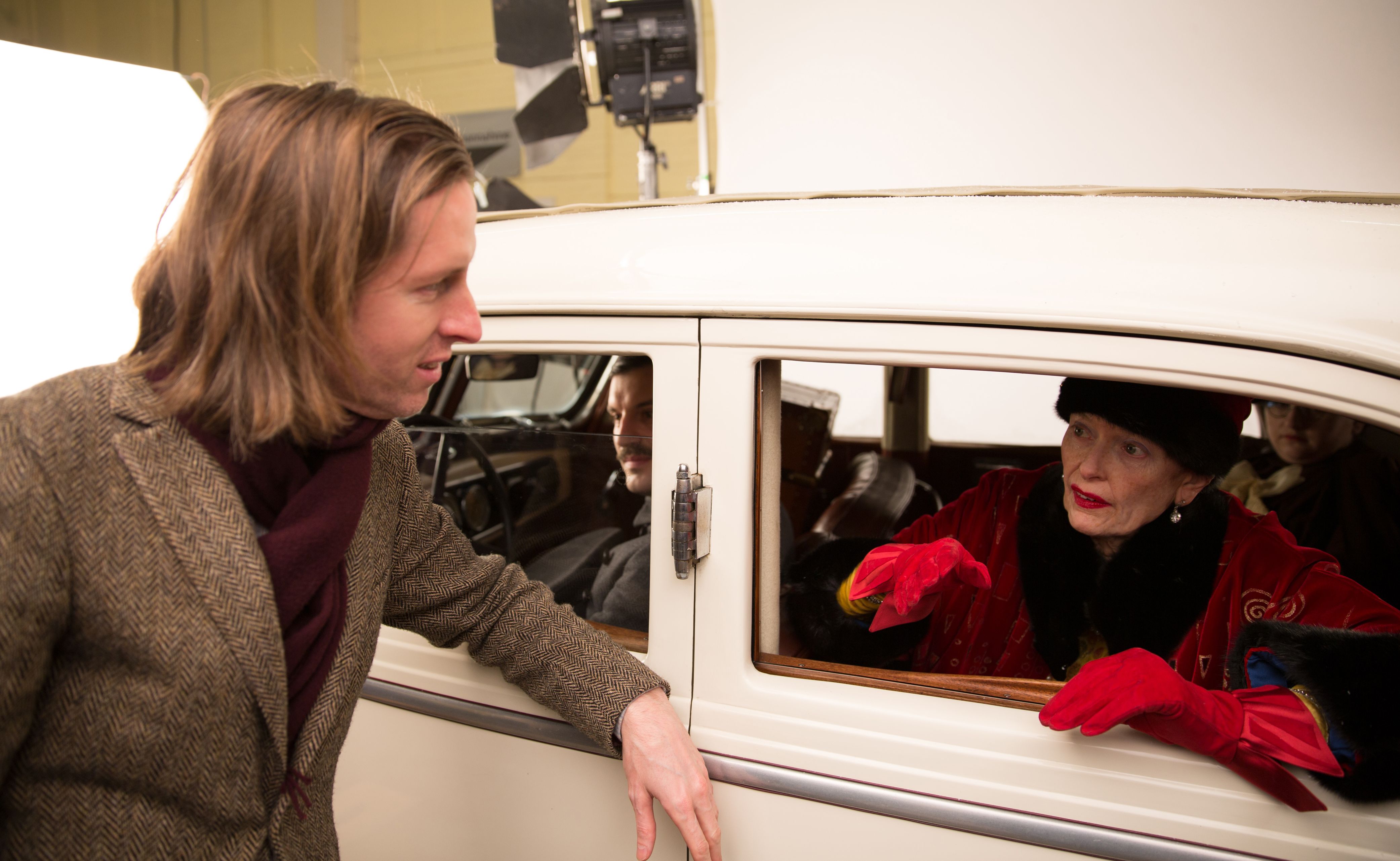 Wes Anderson with Tilda Swinton behind the scenes of The Gra