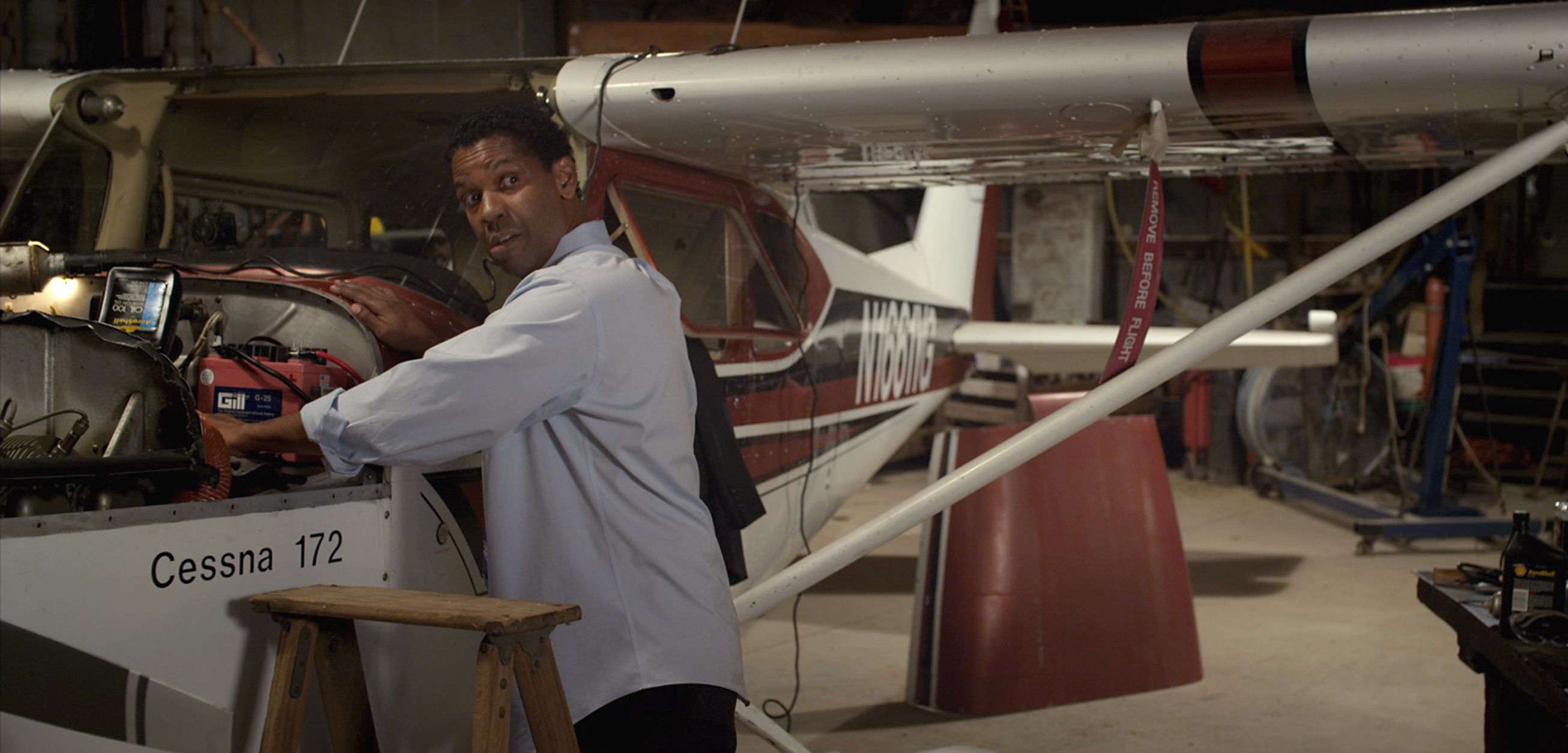 Denzel working on a plane
