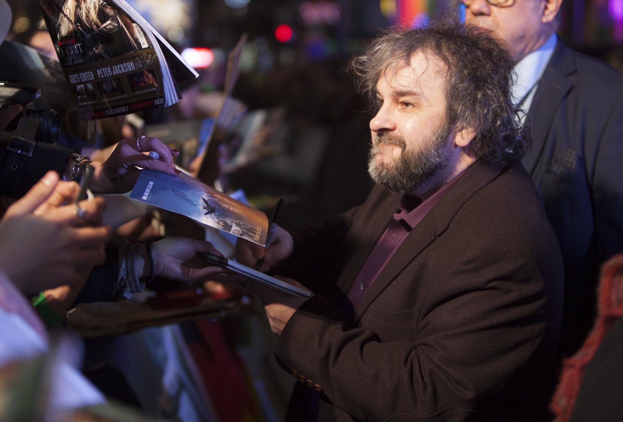 Peter Jackson signing autographs at The Hobbit: The Battle o