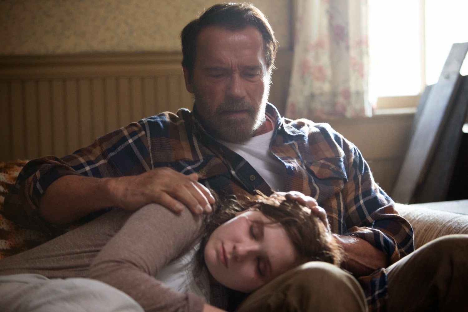 Arnold Schwarzenegger comforts Abigail Breslin in 'Maggie'