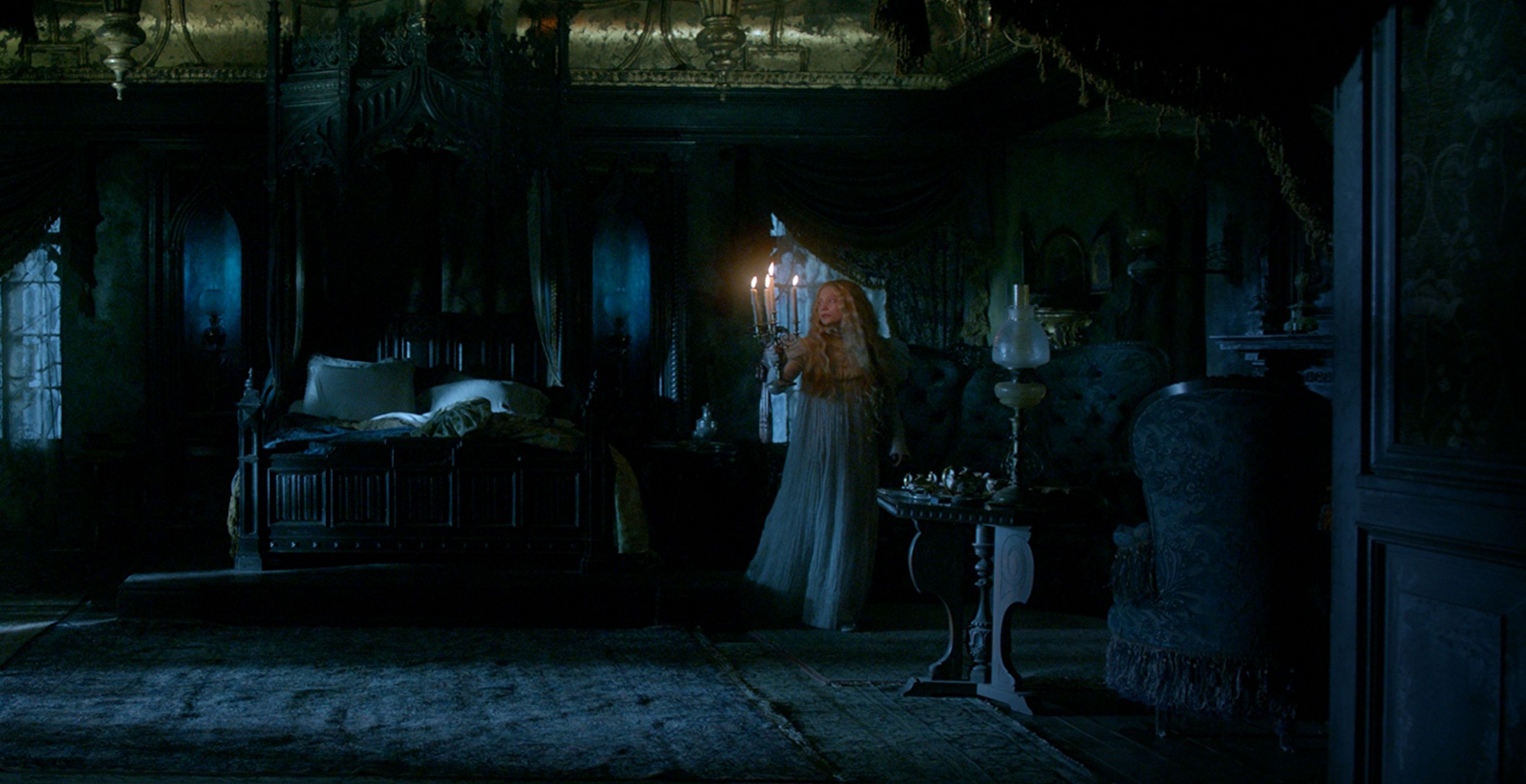 Mia Wasikowska with candles in a dark room, Crimson Peak