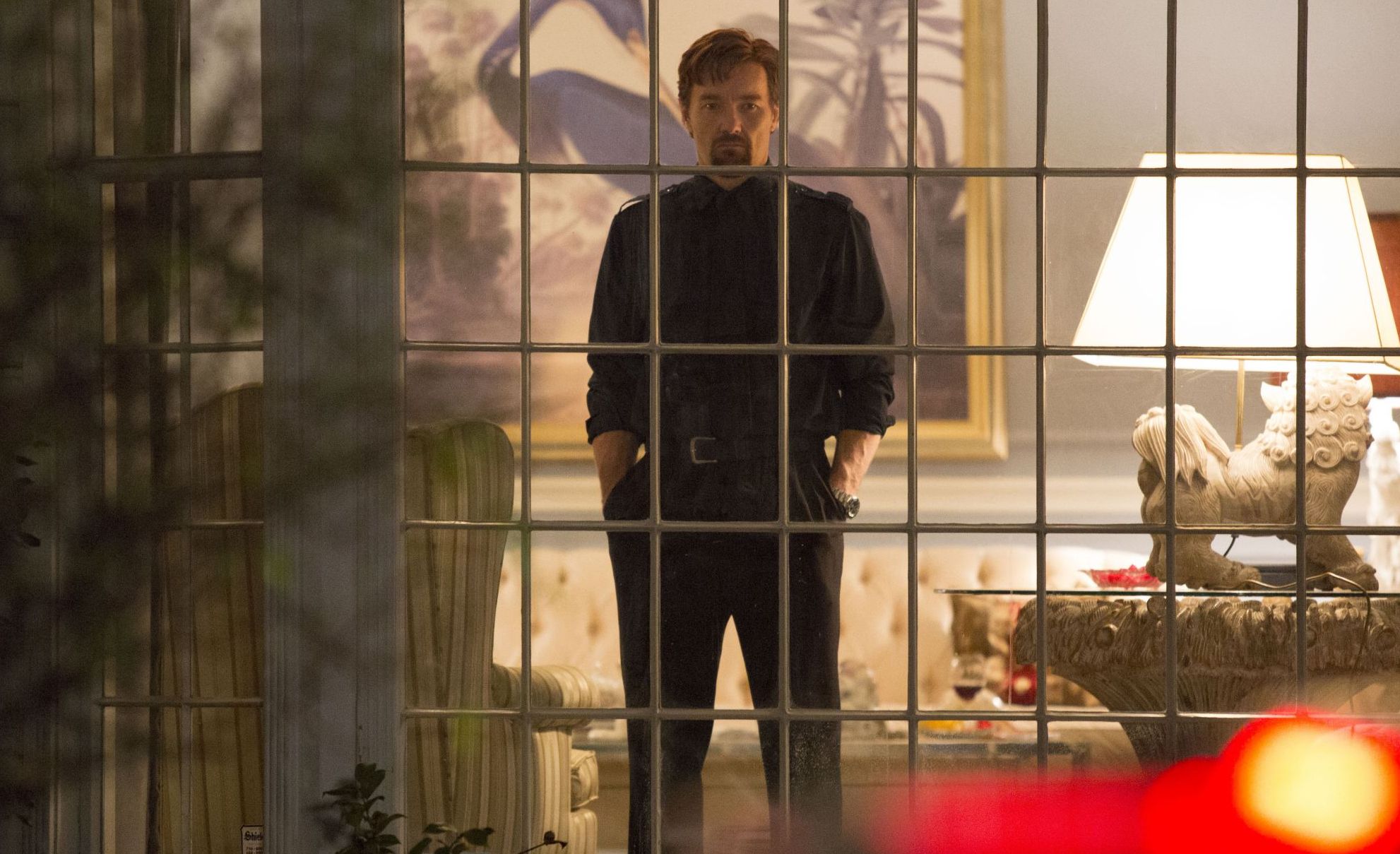 Joel Edgerton behind bars in The Gift