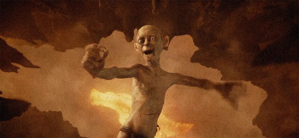 Gollum falls into mount doom with ring, happy