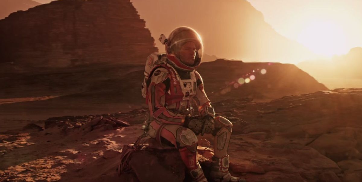 Matt Damon sits in the Mars Sun