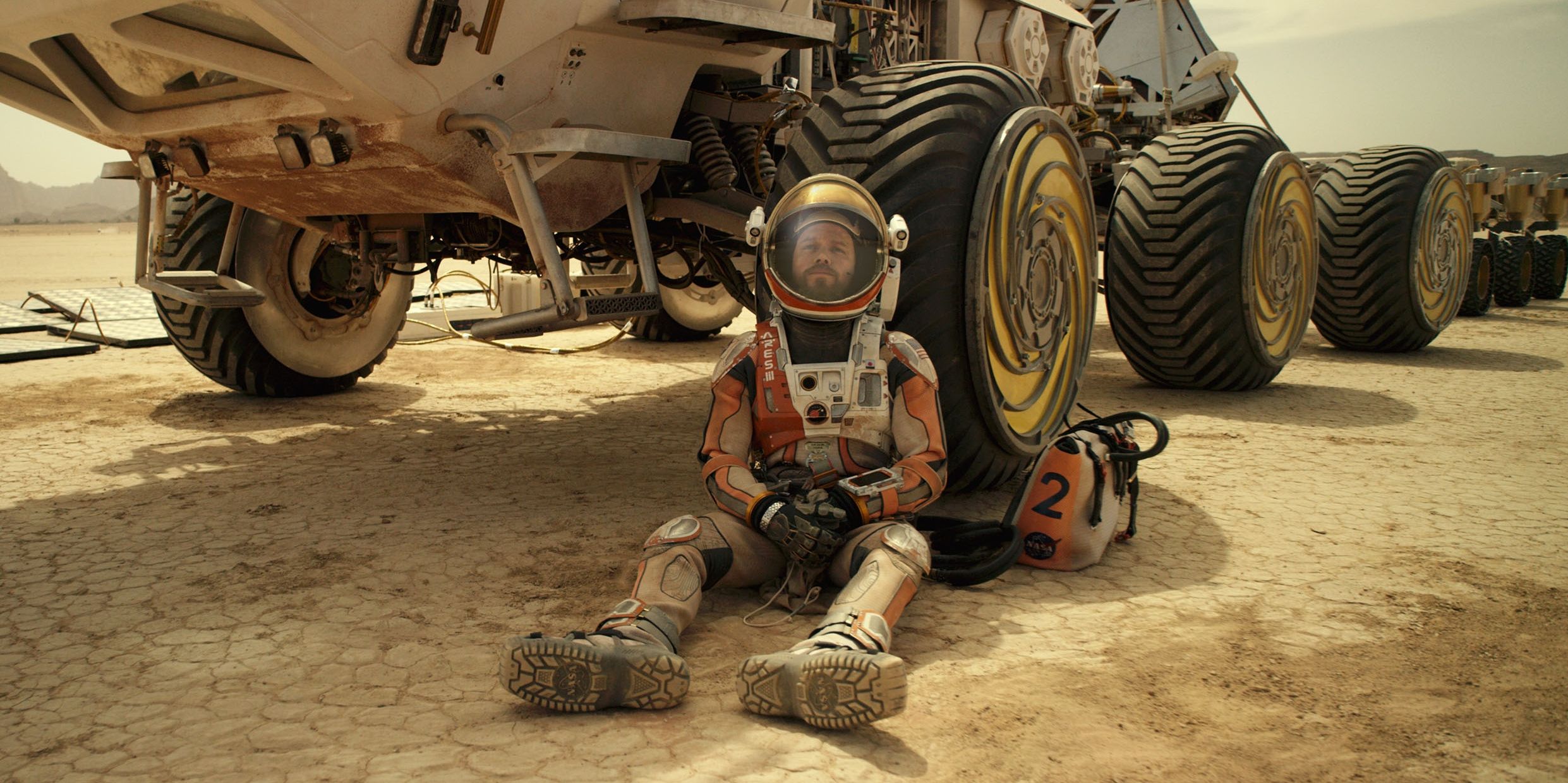 Matt Damon sits around near his space vehicle