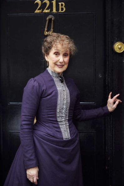 Una Stubbs as Mrs. Hudson