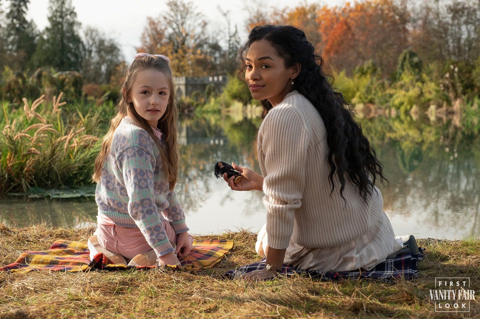 Tahirah Sharif's Miss Jessel examines one of Flora's handmade dolls. EIKE SCHROTER/NETFLIX