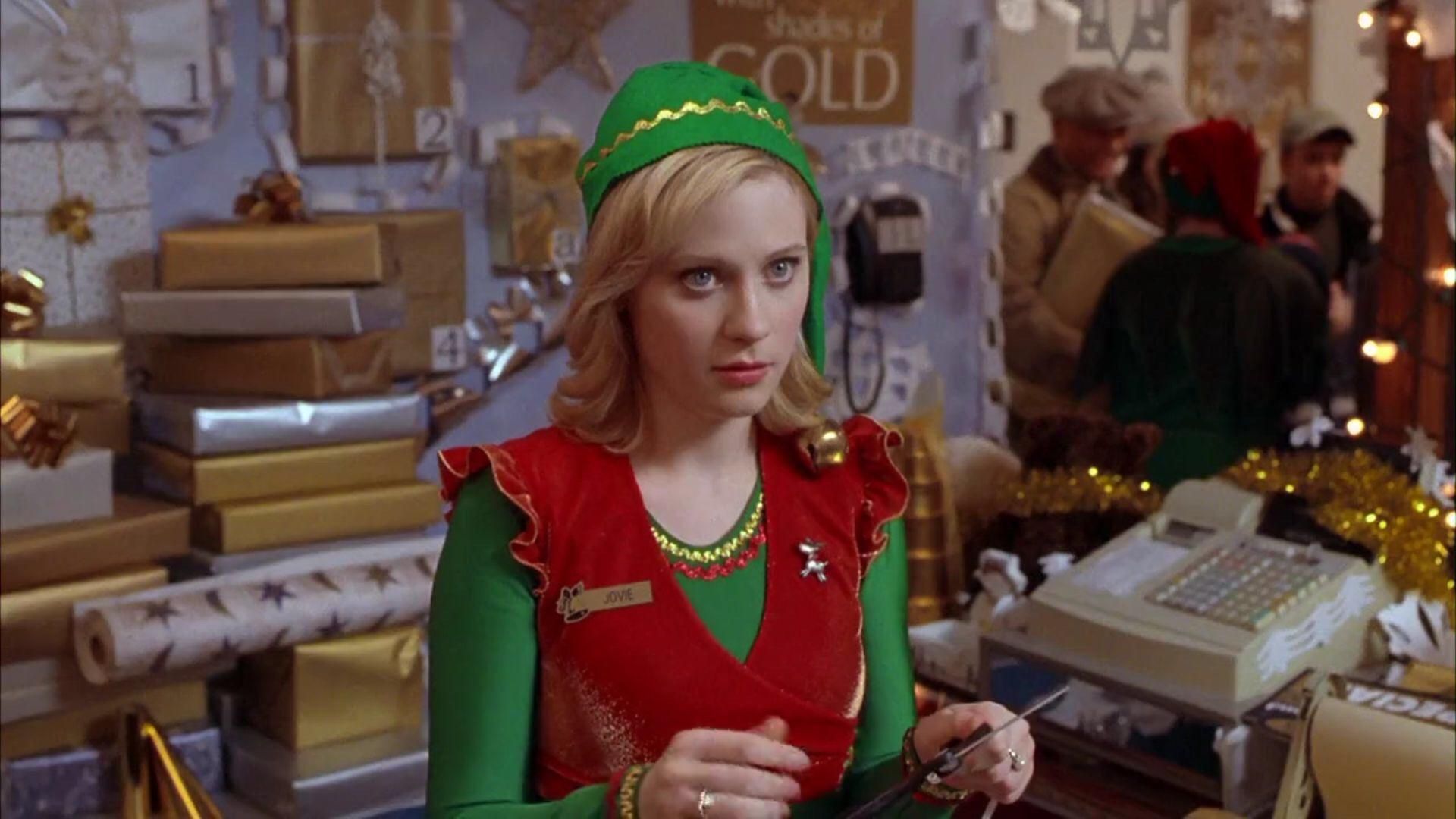 Not a North Pole elf, but elf enough to capture Elf&#039;s heart. Zooey Deschanel plays store elf Jovie.