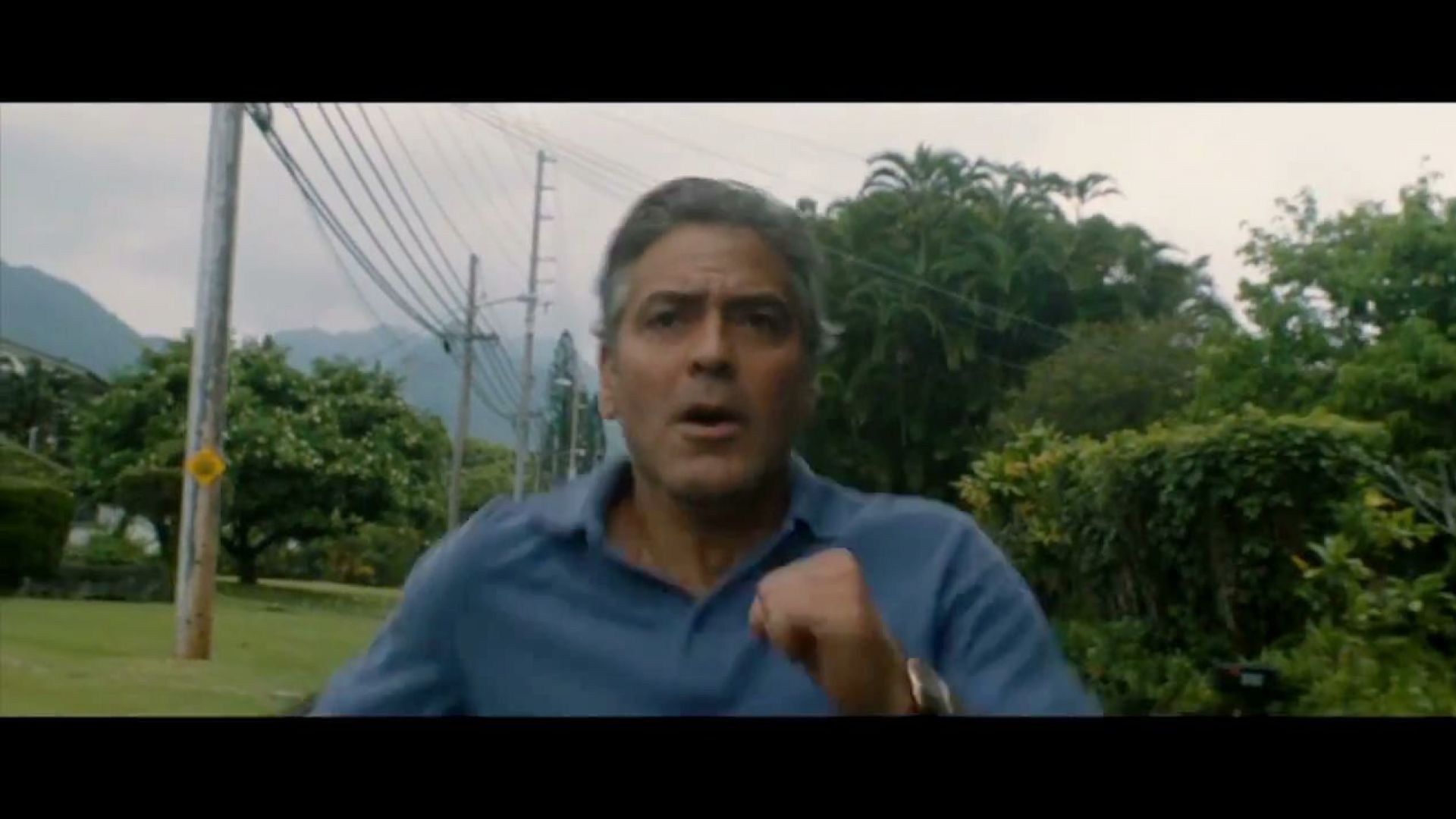 George Clooney runs in The Descendants